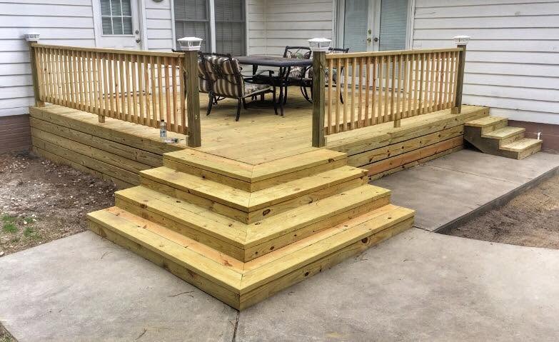 Completed multi-level deck with stairs and railing