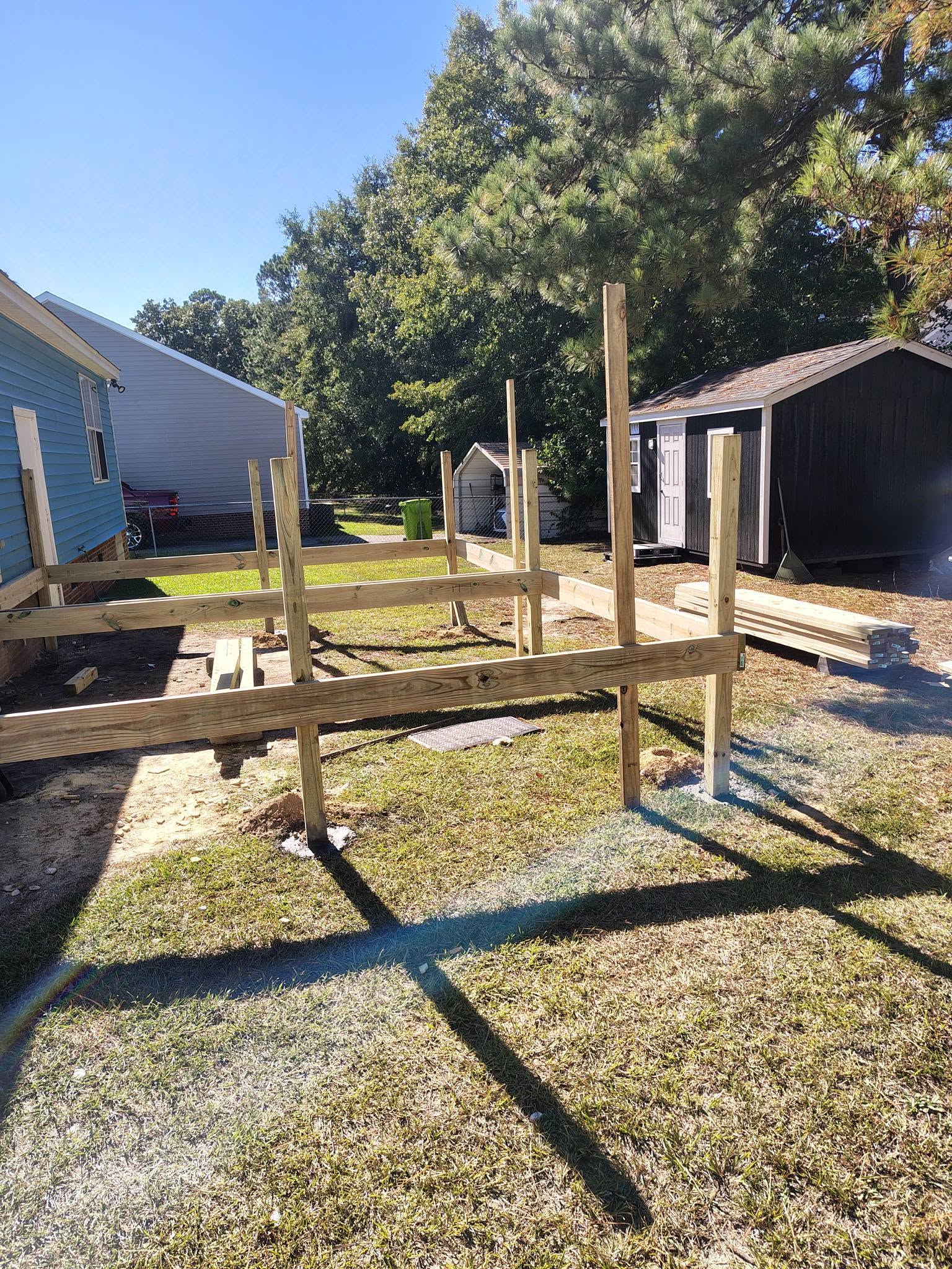 Pressure-treated deck framing in progress